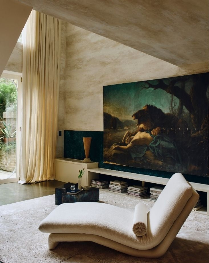 Living room with cream chaise lounge and classical lion painting from a Tala Fustok Studio project