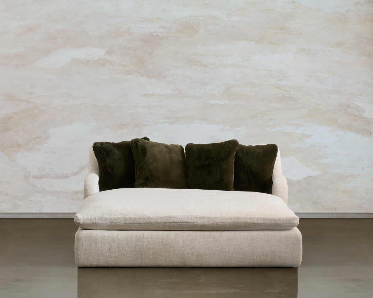 Front view of the Lazy Sunday lounge, with four olive cushions along the cream back