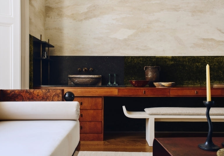 Walnut desk with an integrated stone basin and olive velvet panelling in the Ladbroke Grove apartment