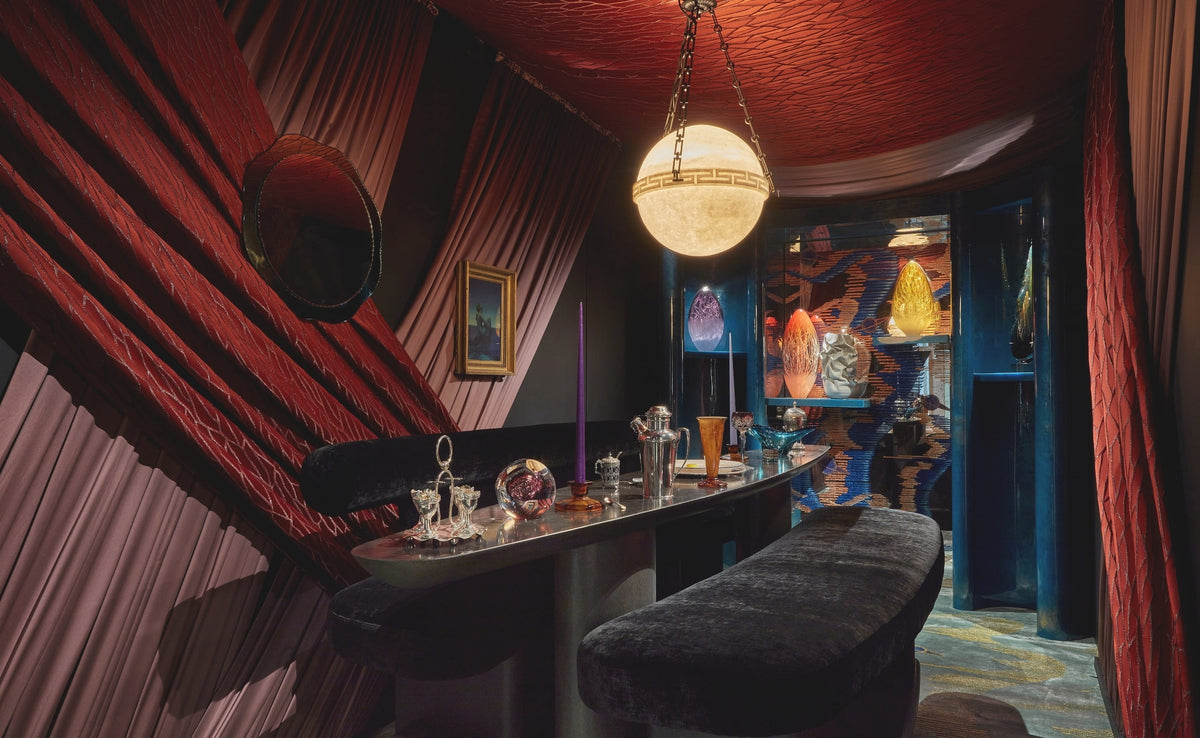 Art Deco Home Bar with a quilted red ceiling and alabaster globe light at WOW!house 2023 by Tala Fustok Studio