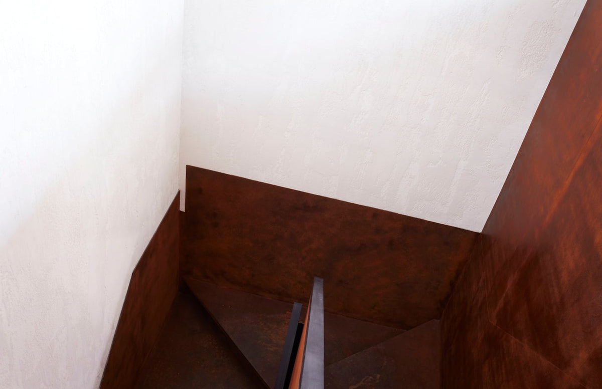 Corten steel stairwell viewed from above in the New York SoHo apartment by Tala Fustok Studio