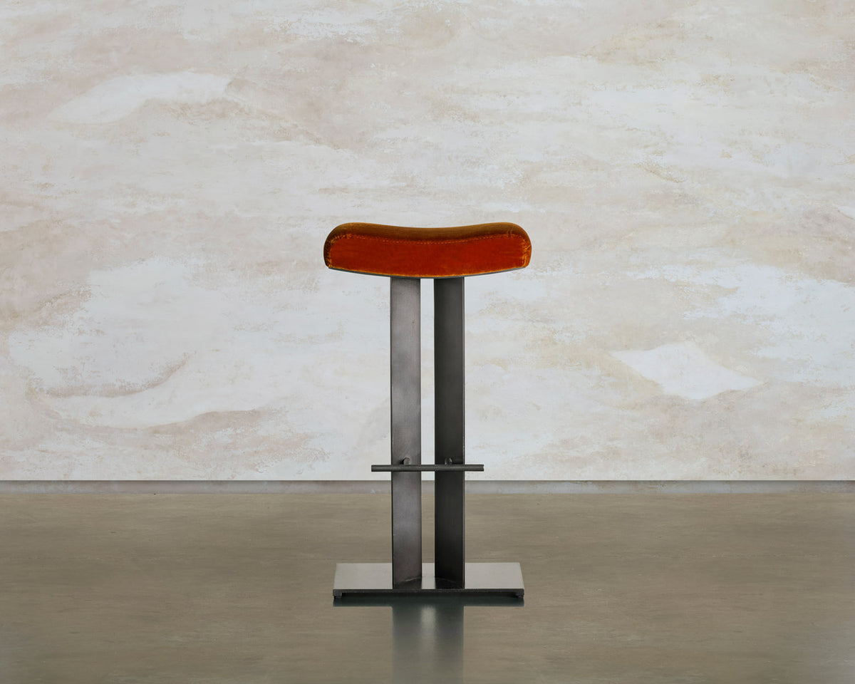 Front view of the Tonic barstool, showing the saddle seat, twin steel legs, and foot bar