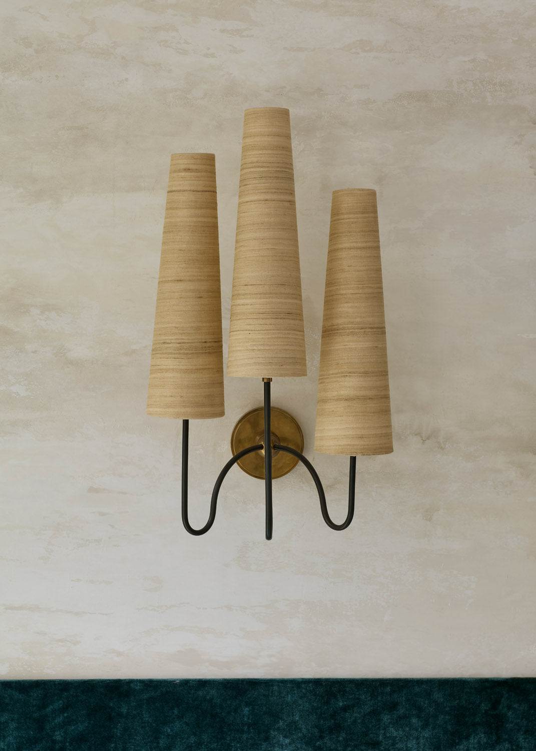 Union wall light by Tala Fustok Studio, three raw silk shades on dark bronze arms